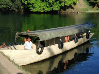 Dugout canoe (with outboard) and owner